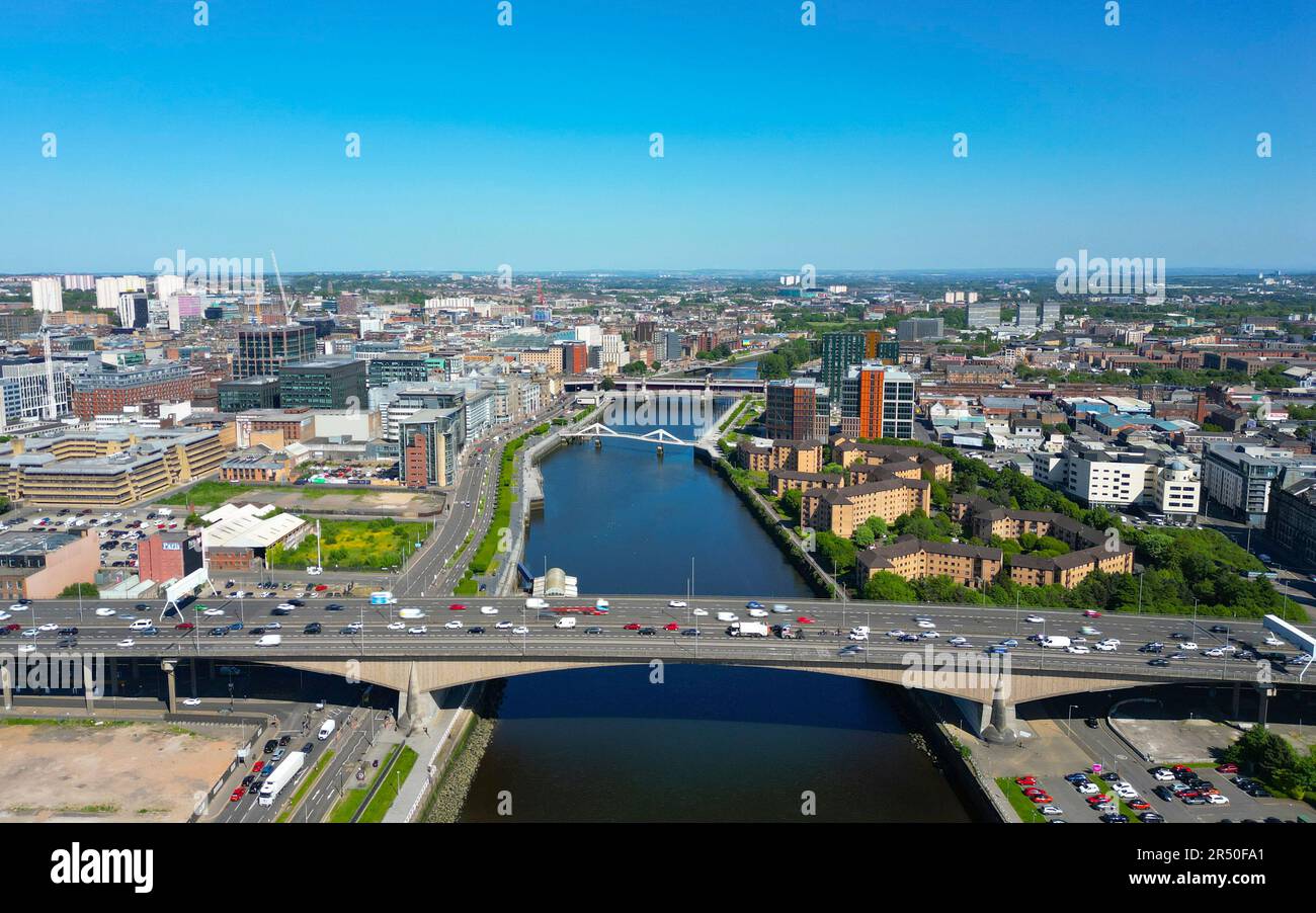 Aerial view from drone of Glasgow city centre skyline along River Clyde ...