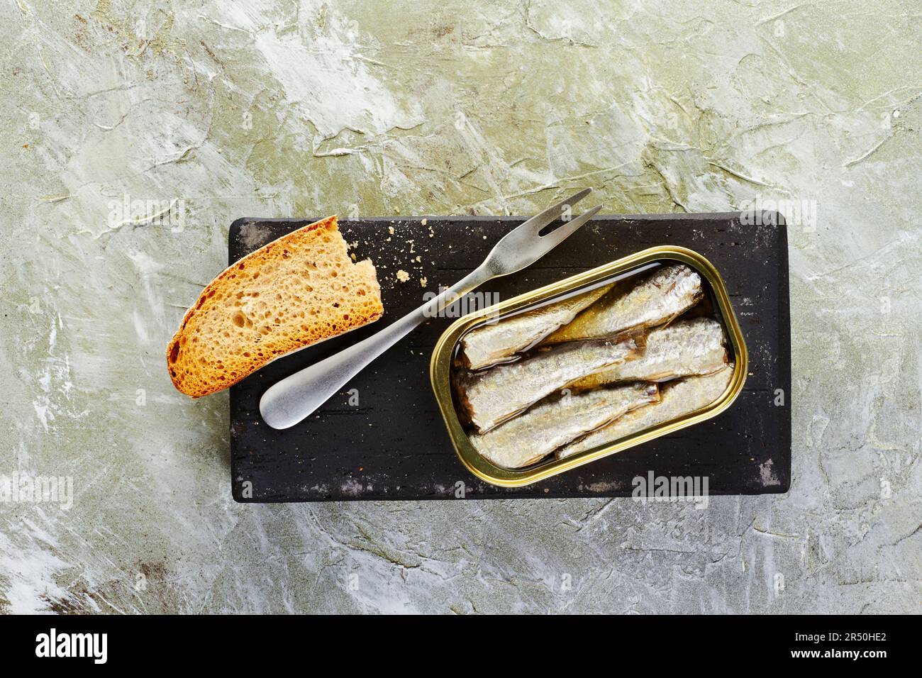 Canned sardines in olive oil served with toasted bread Stock Photo Alamy