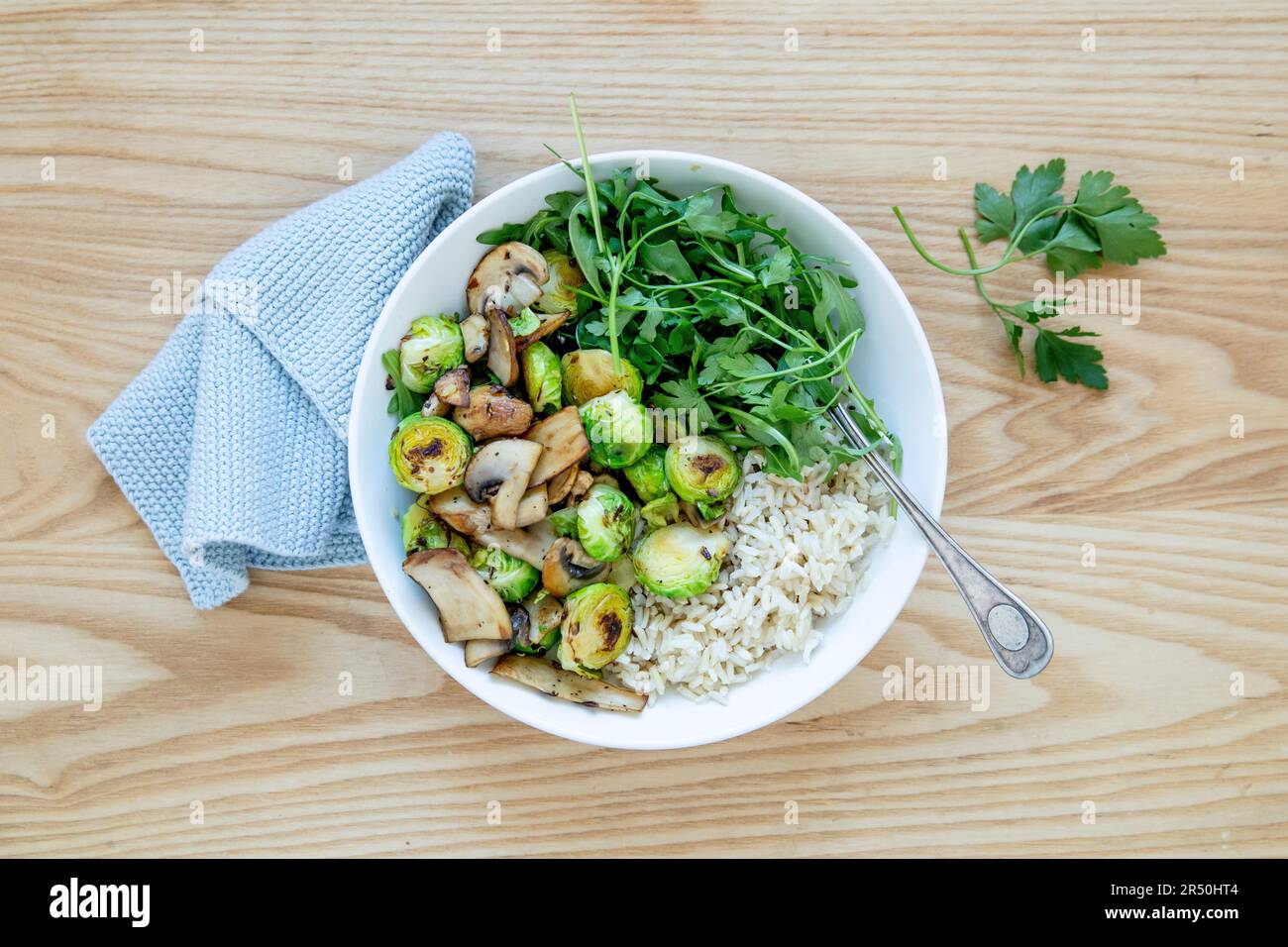 Mushroom and Brussels sprouts with rice in a bowl Stock Photo