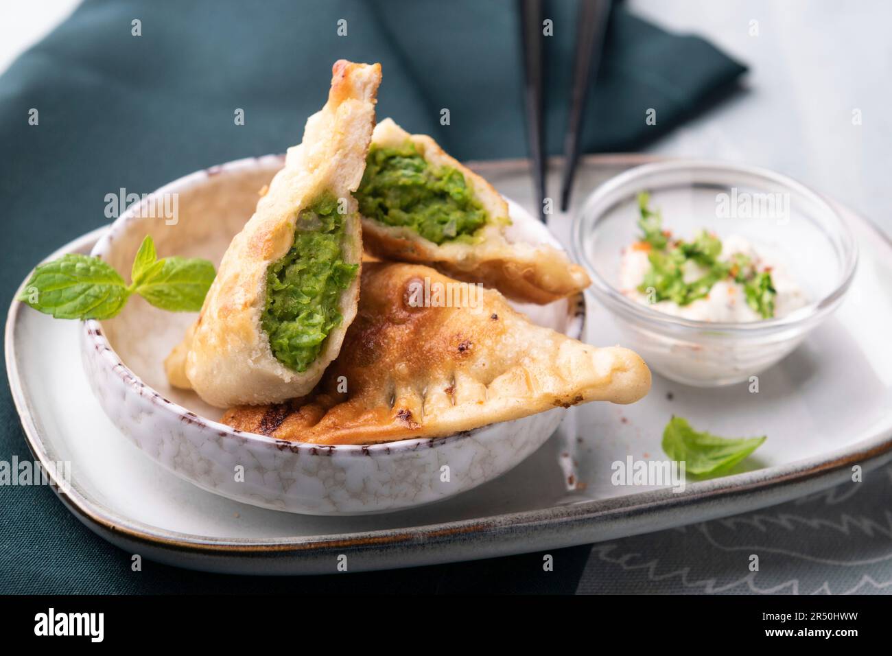 Vegan panfried dumplings filled with peas and mint Stock Photo Alamy
