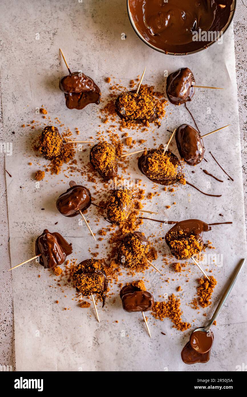 Dates in chocolate cookies crumb coating Stock Photo Alamy