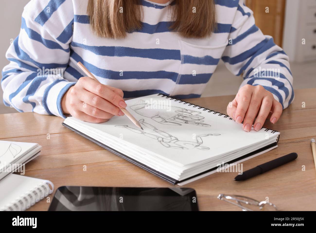 Woman Drawing in Sketchbook with Pencil at Wooden Table, Top View Stock  Image - Image of draw, leisure: 243607331