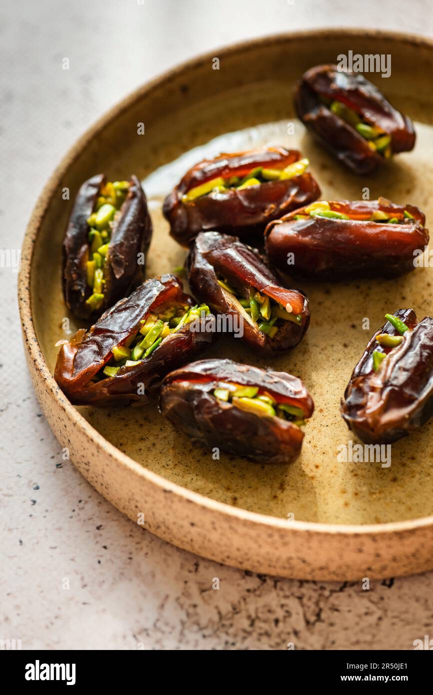Dates stuffed with Pistachio served Iftar during Ramadan Stock Photo