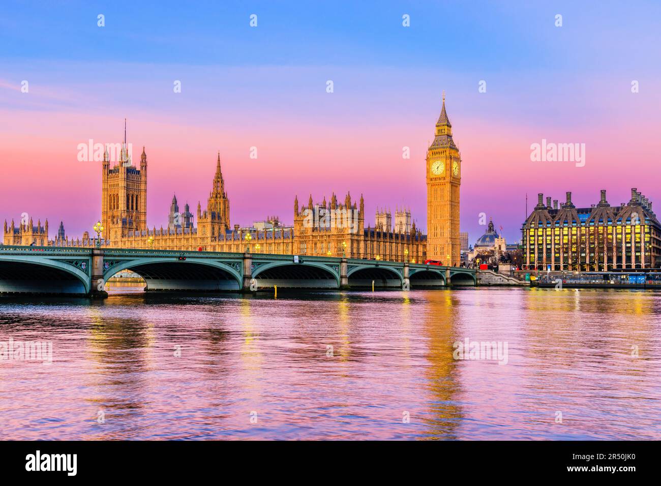 London, United Kingdom. The Palace of Westminster, Big Ben, and Westminster Bridge at sunrise. Stock Photo