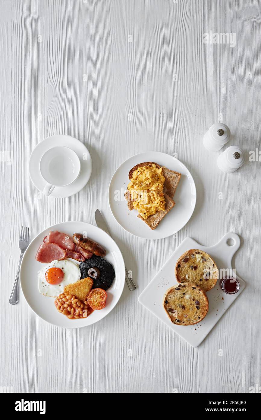 A full English breakfast, scrambled eggs on toast and a toasted fruit