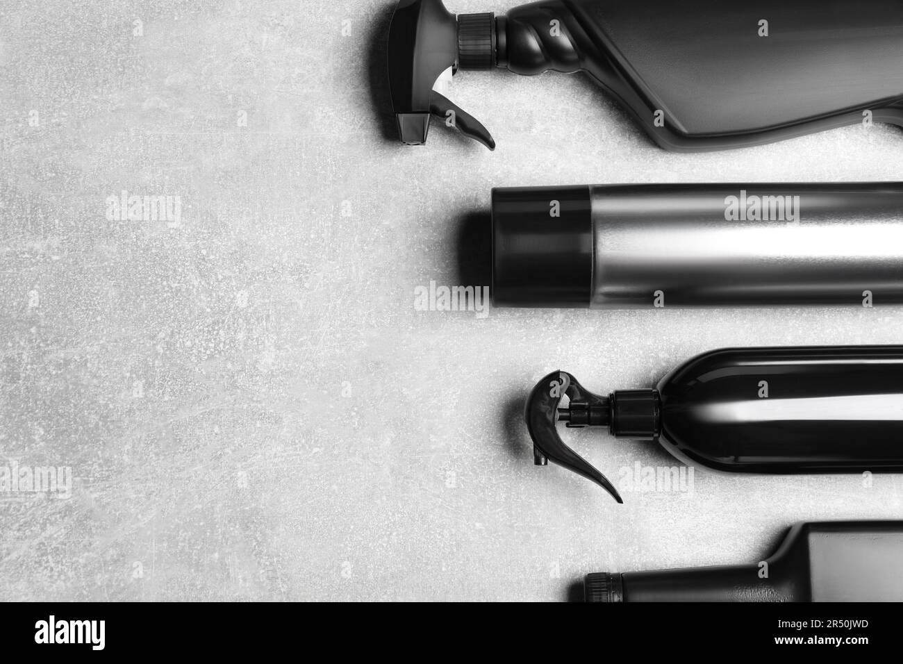 Flat lay composition with car cleaning products on light grey table ...