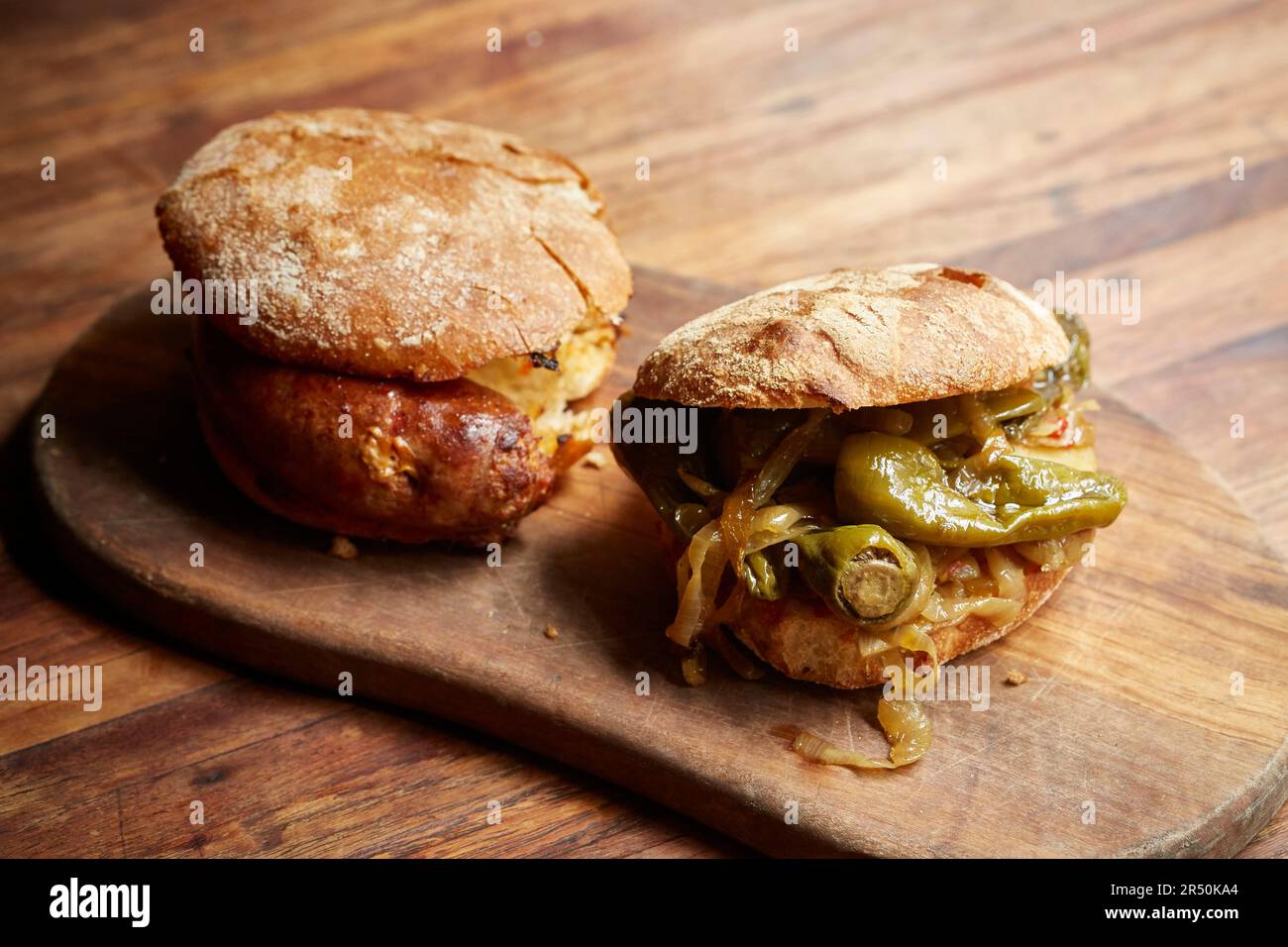 Peppers and onions in a rustic roll Stock Photo