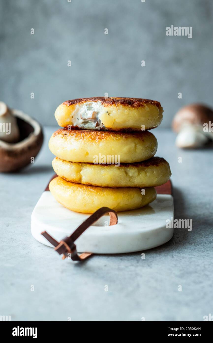 Potato cakes with mushroom and cream cheese filling Stock Photo