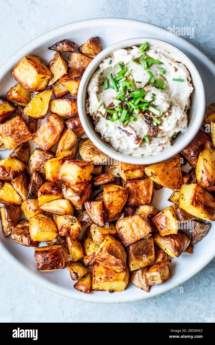 Crispy baked diced potatoes with French onion dip Stock Photo Alamy