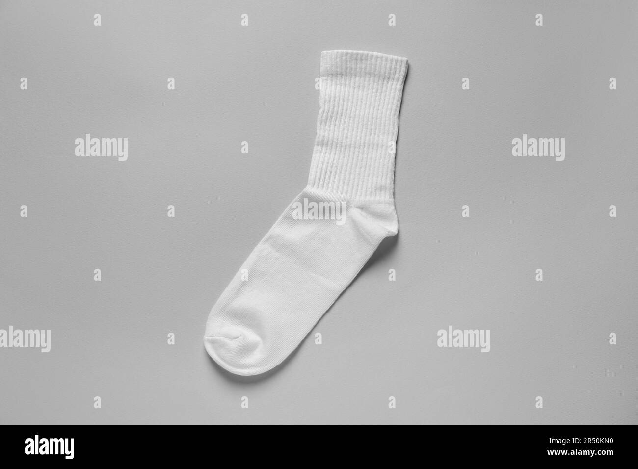 One white sock on light grey background, top view Stock Photo Alamy