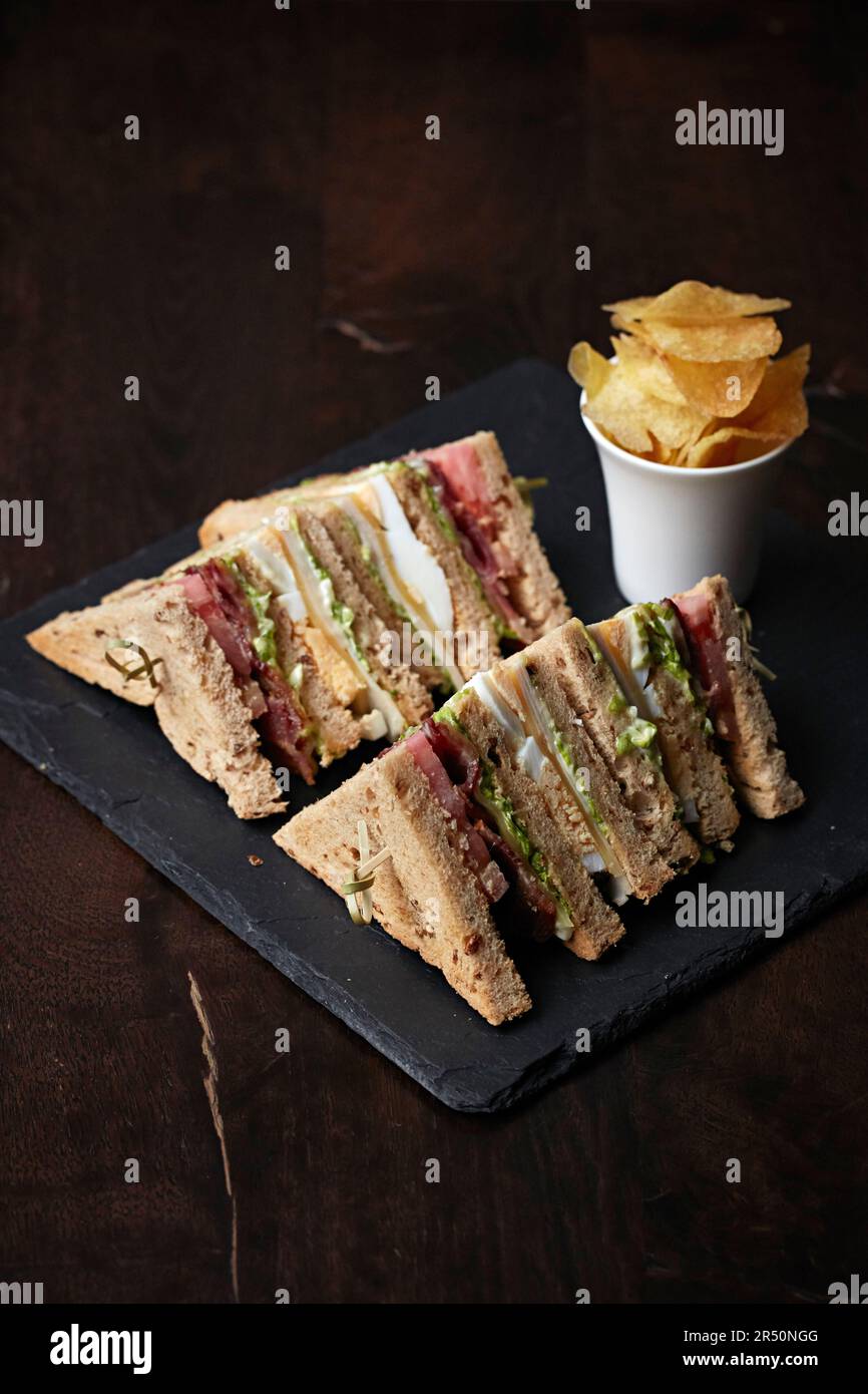 Club sandwiches served with fries Stock Photo