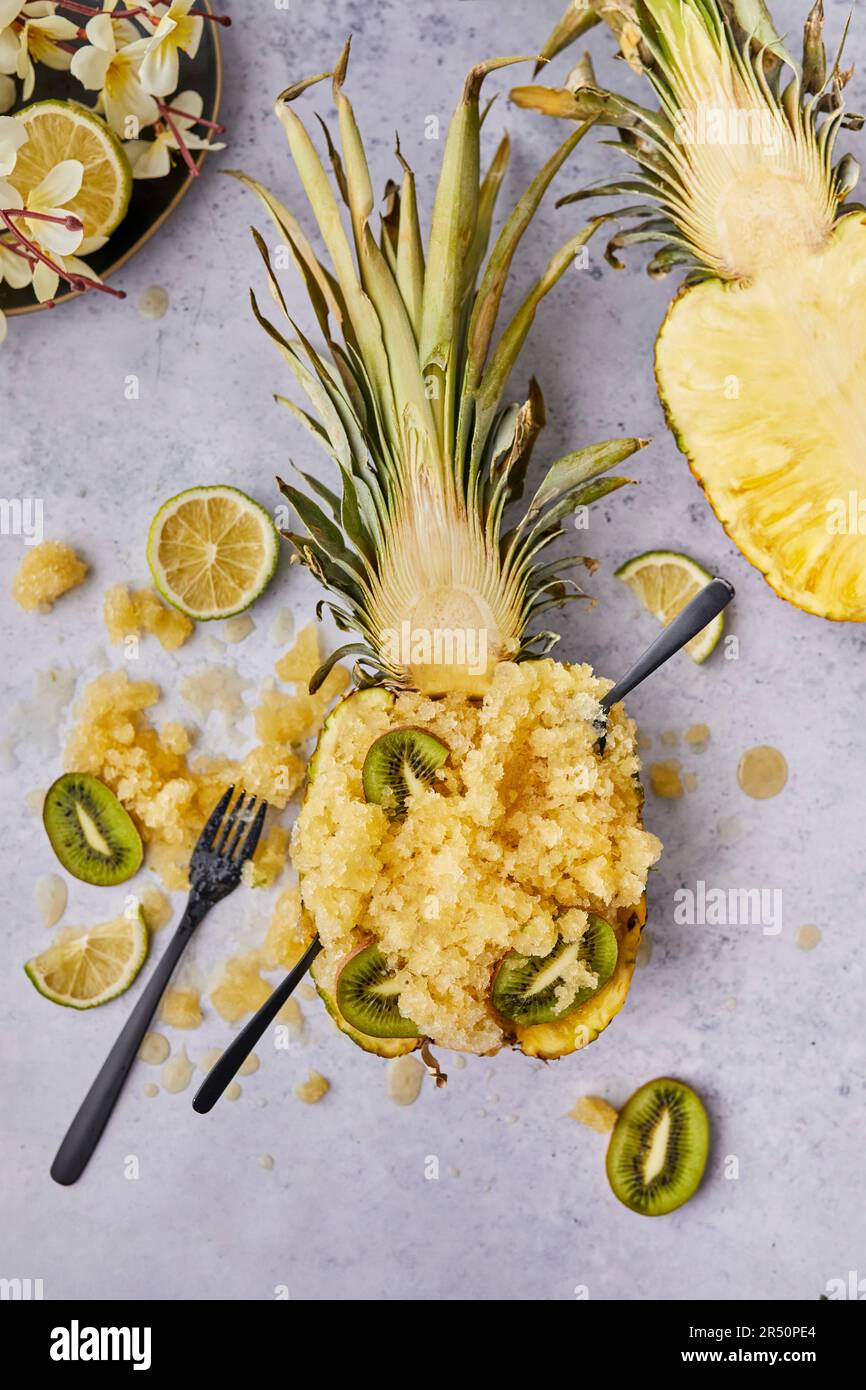 Pineapple granita dessert served in pineapple boat Stock Photo Alamy