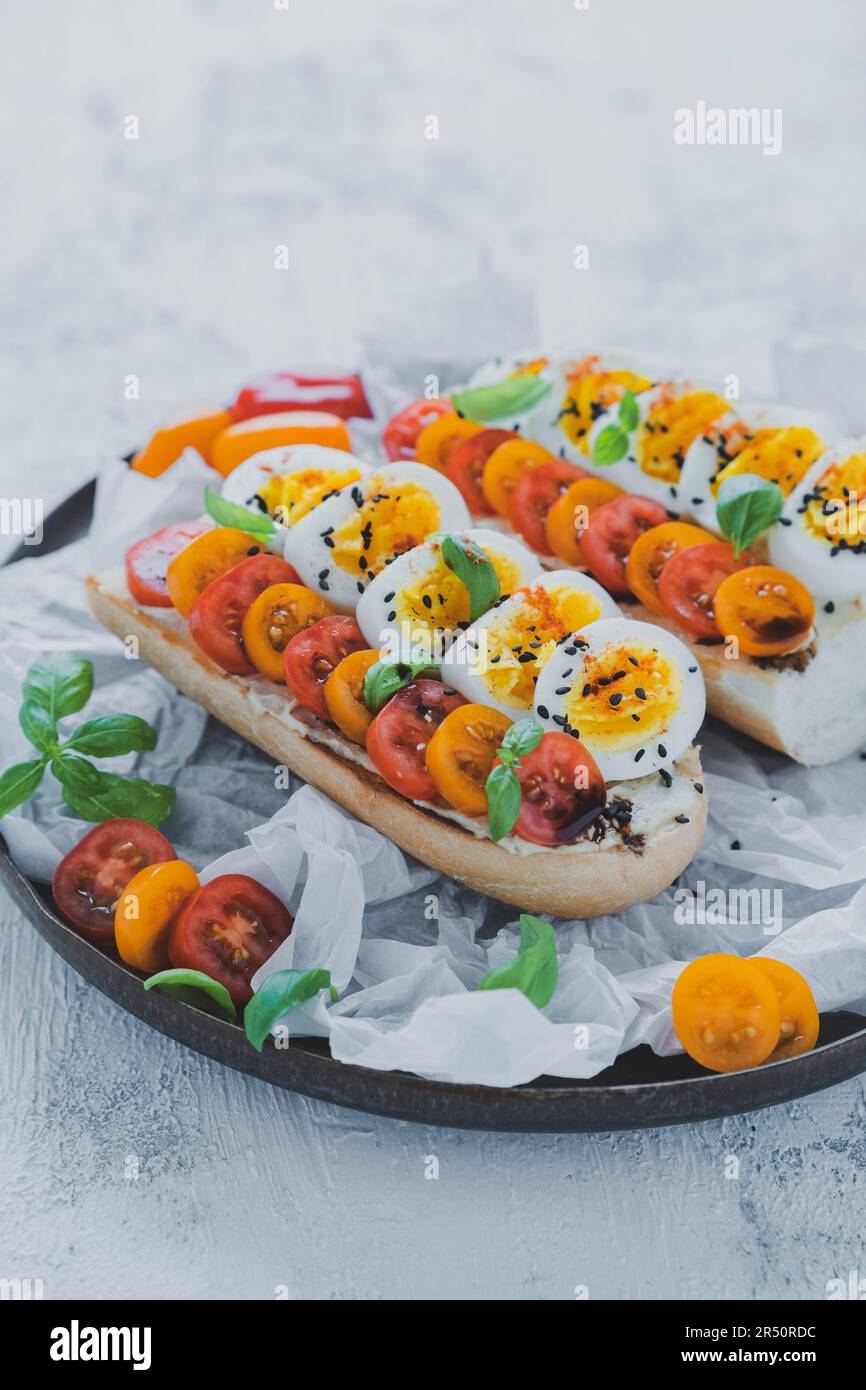 Sandwich with egg and cherry tomatoes Stock Photo