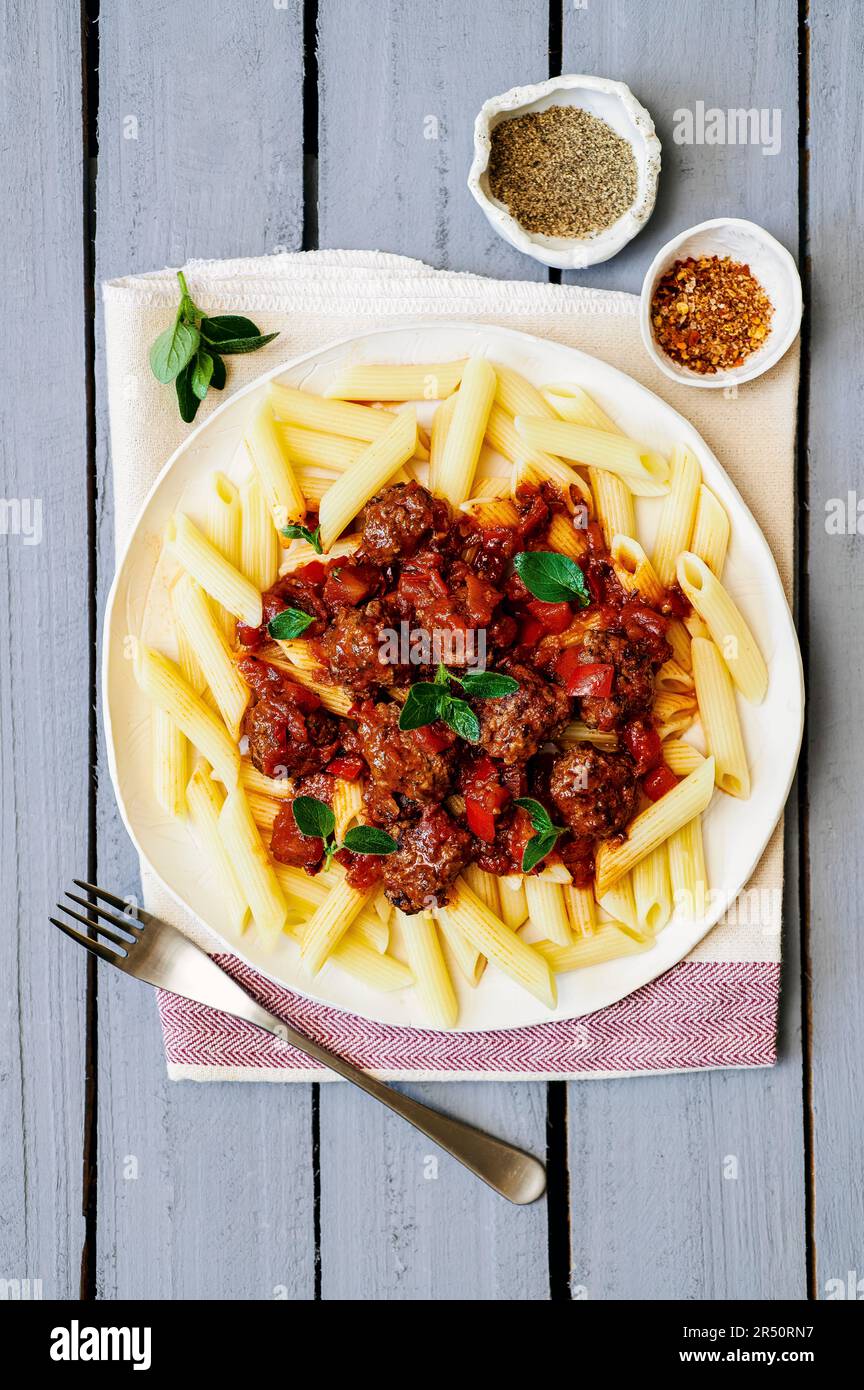 Penne with mini meatballs Stock Photo