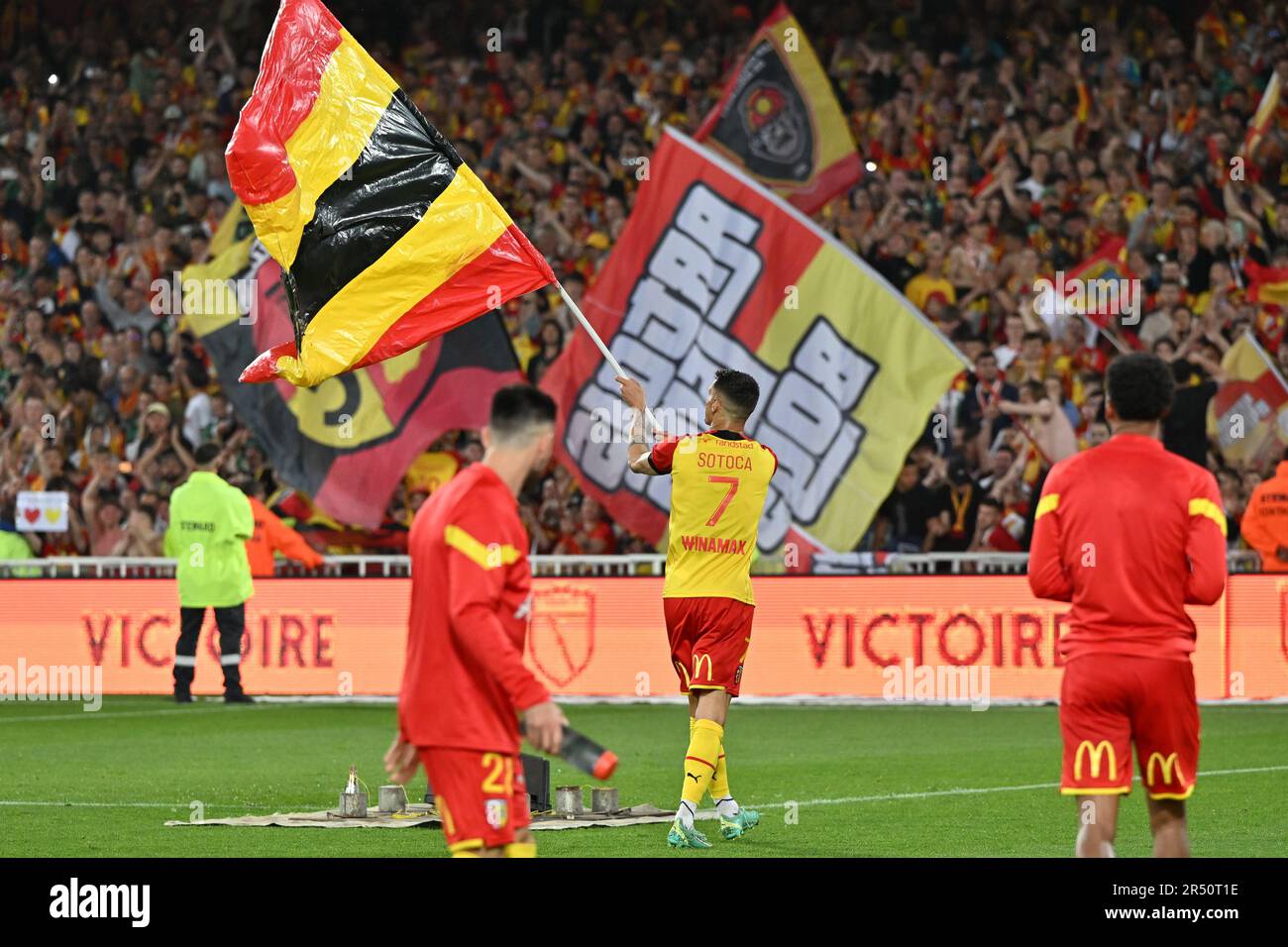 players of RC Lens and their president Joseph Oughourlian pictured  celebrating after winning and qualifying for the Champions League after a  soccer game between t Racing Club de Lens and AC Ajaccio