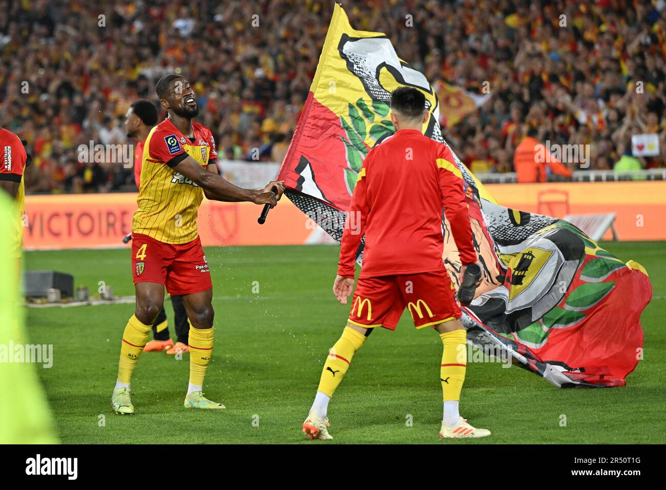 players of RC Lens and their president Joseph Oughourlian pictured  celebrating after winning and qualifying for the Champions League after a  soccer game between t Racing Club de Lens and AC Ajaccio