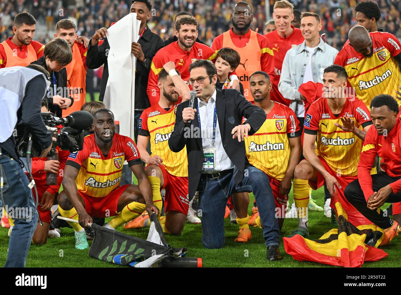 players of RC Lens and their president Joseph Oughourlian pictured  celebrating after winning and qualifying for the Champions League after a  soccer game between t Racing Club de Lens and AC Ajaccio