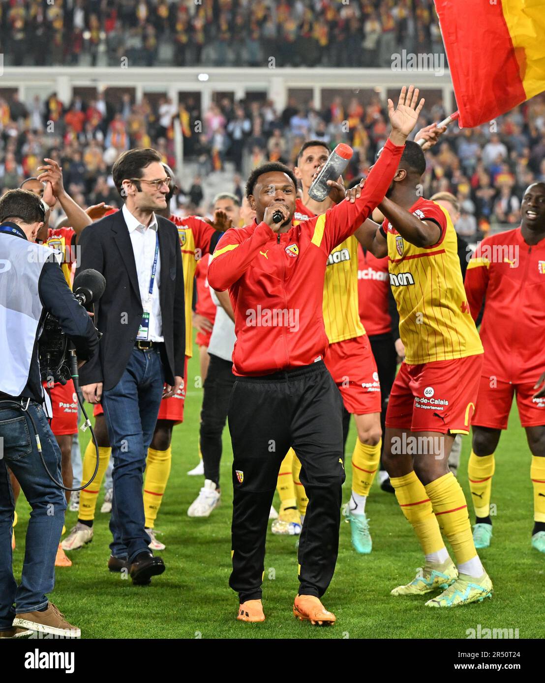 President Joseph Oughourlian of RC Lens pictured celebrating with his  players of RC Lens after winning a soccer game between t Racing Club de Lens  and AC Ajaccio, on the 37th matchday