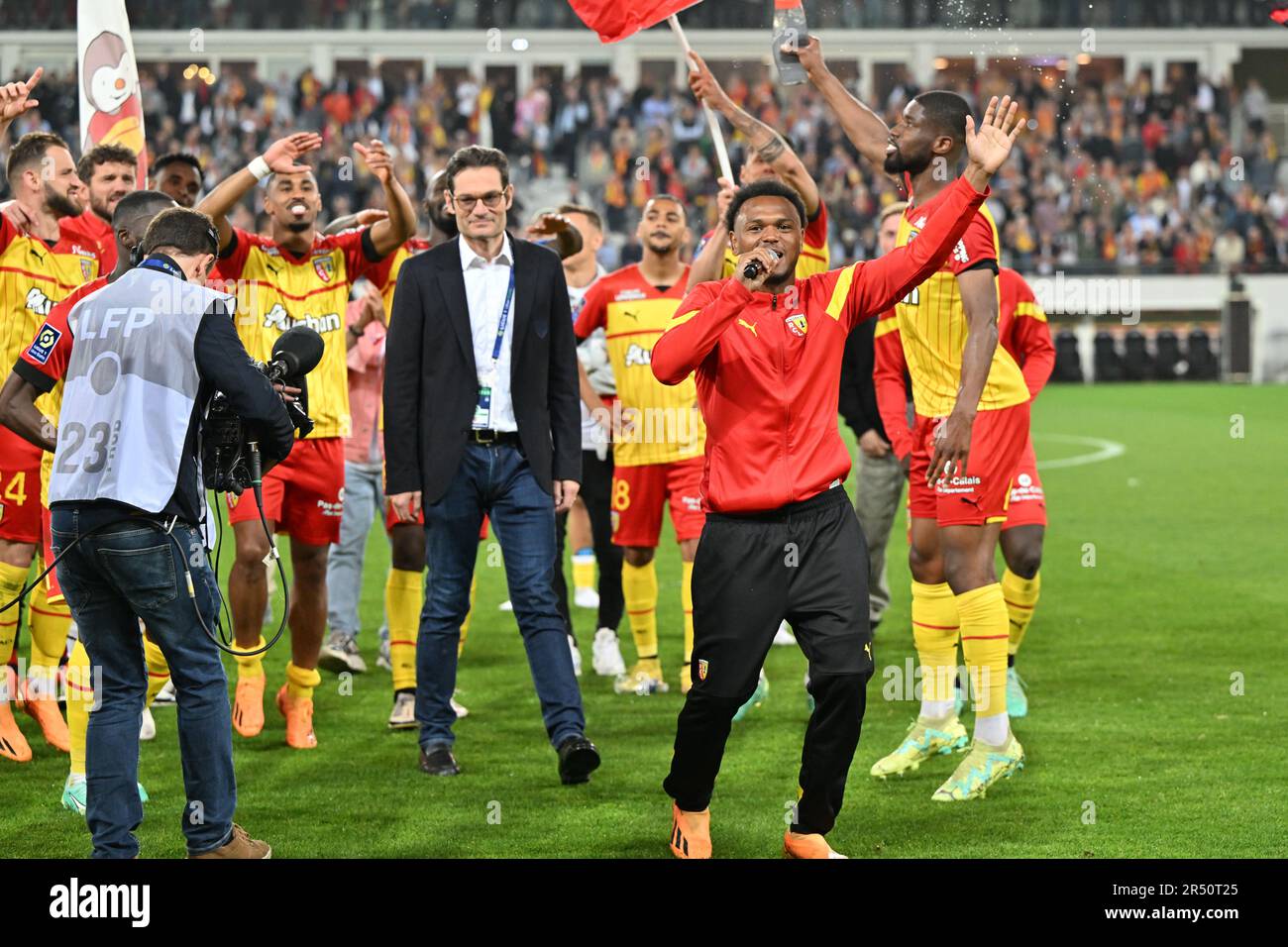 players of RC Lens and their president Joseph Oughourlian pictured  celebrating after winning and qualifying for the Champions League after a  soccer game between t Racing Club de Lens and AC Ajaccio