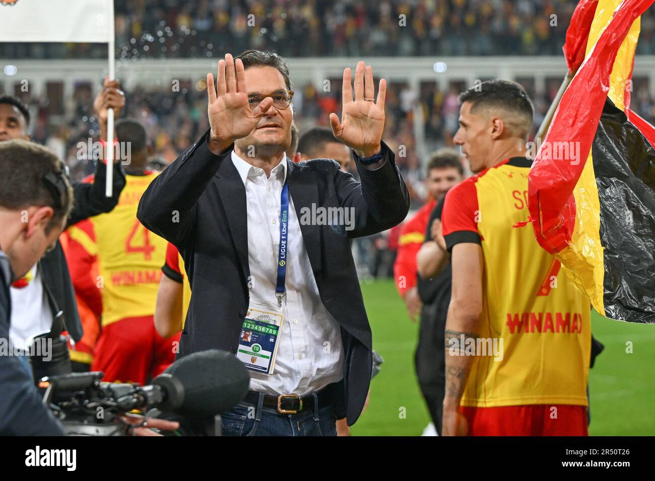 players of RC Lens and their president Joseph Oughourlian pictured  celebrating after winning and qualifying for the Champions League after a  soccer game between t Racing Club de Lens and AC Ajaccio