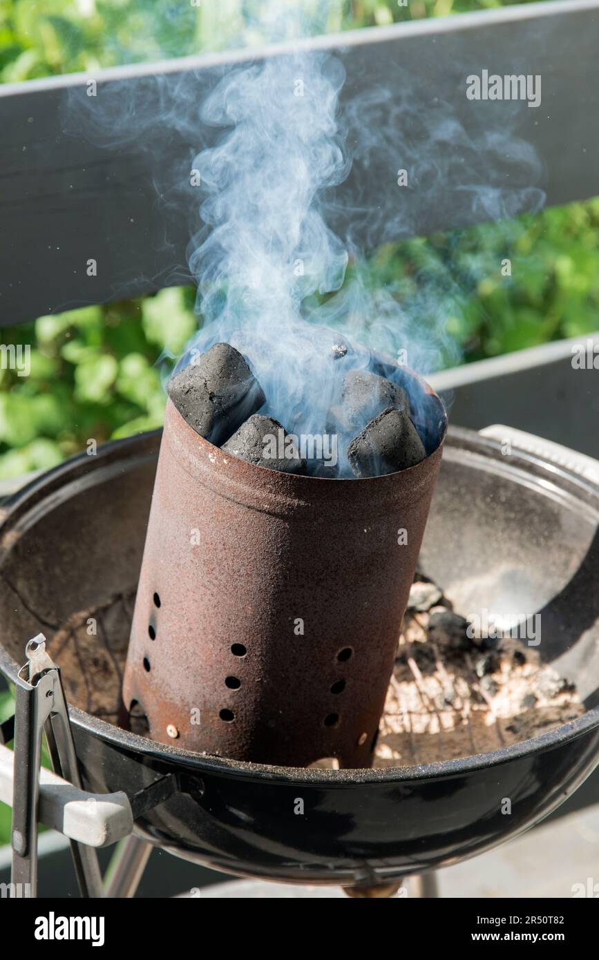 Lighting a barbeque Stock Photo Alamy