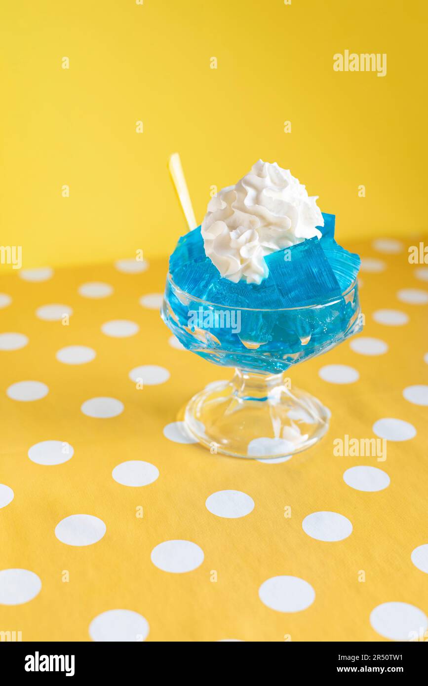 Pop art picture of blue jelly with whipped cream Stock Photo Alamy