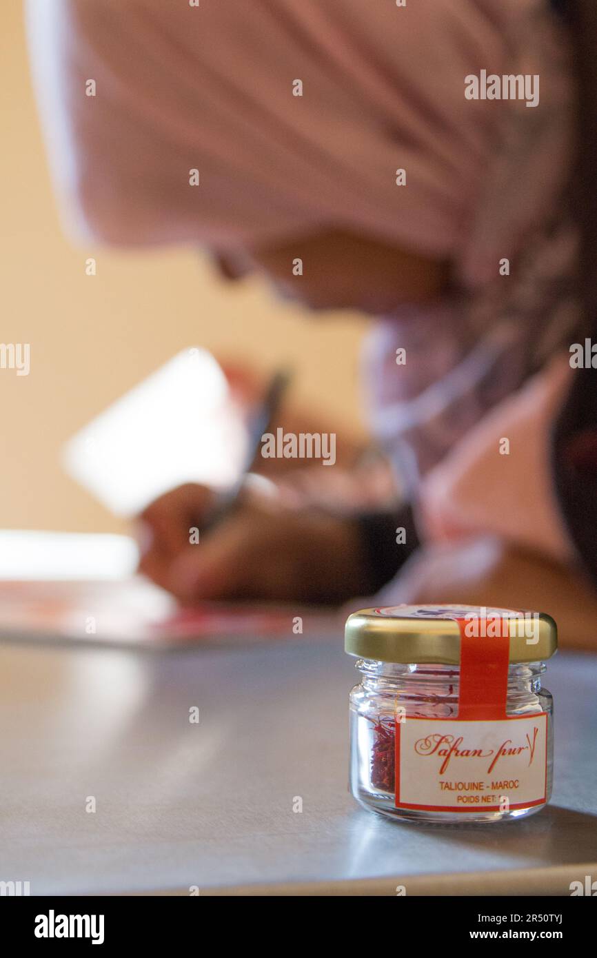 Female Saffron Growers at a Taliouine Co-op in Morocco, Applying Labels to Their Saffron Brand Packs Stock Photo
