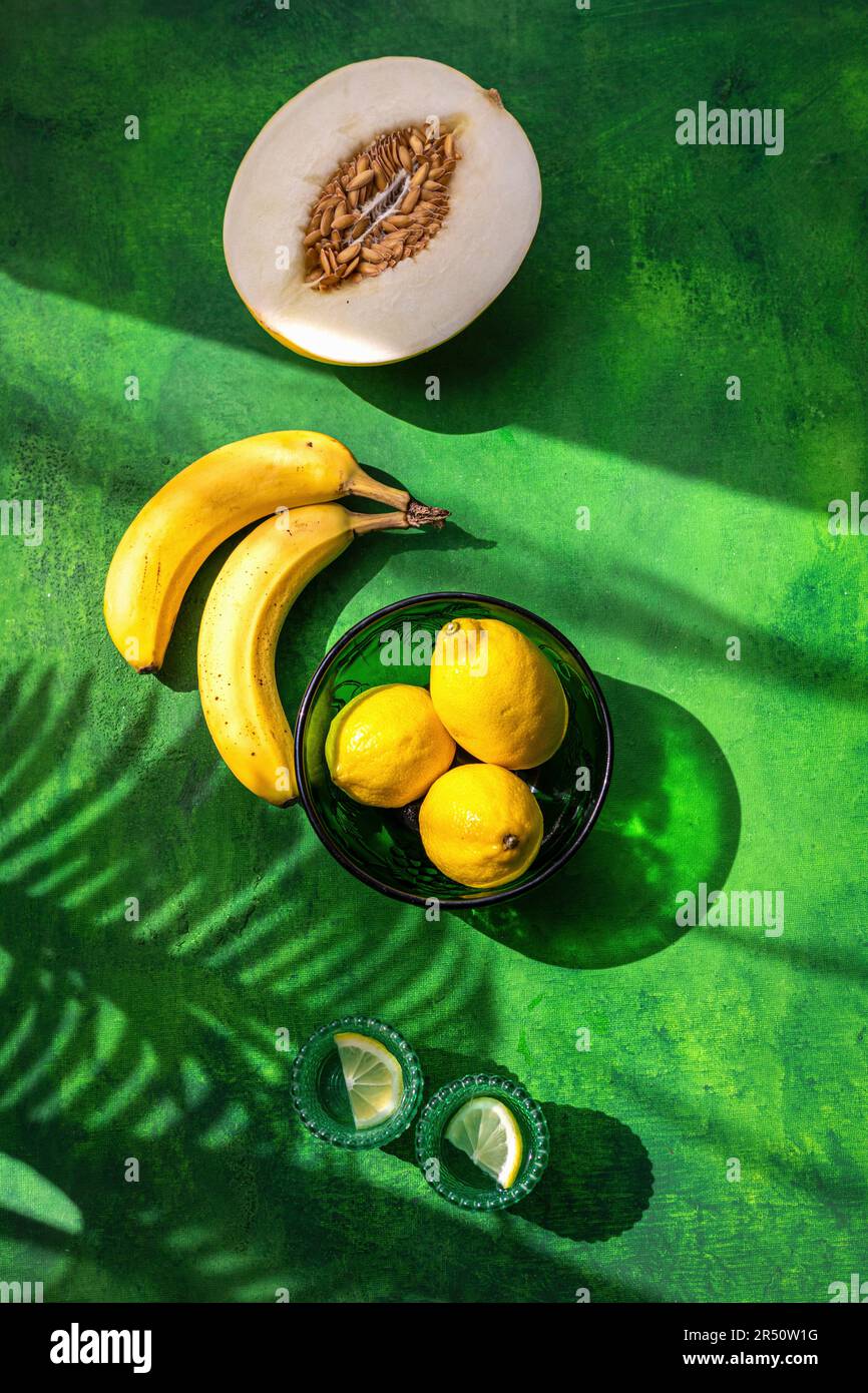 Lemons, bananas and Galia melon Stock Photo
