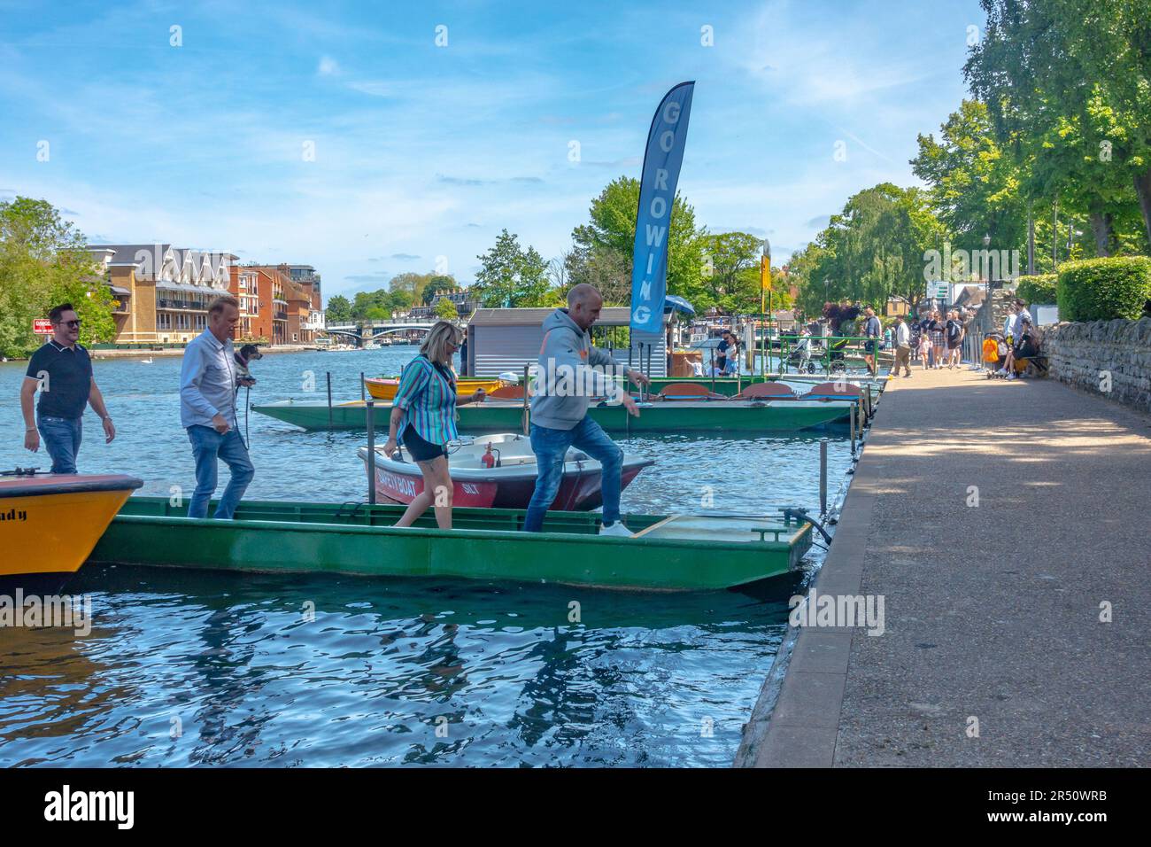 People disembark a hire boat in The River Thames at Windsor in Berkshire, UK Stock Photo