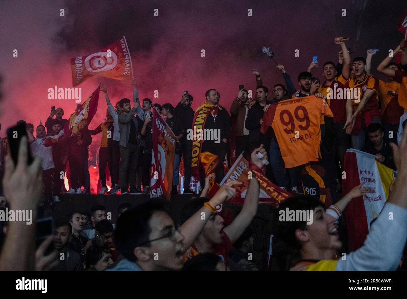 Ankara, Turkey. 30th May, 2023. Galatasaray fans sing championship songs. Defeating MKE Ankaragucu 4-1 away in Spor Toto Super League, Galatasaray declared its championship 2 weeks before the end. The yellow-red team thus became the league champion for the 23rd time after 3 years. Reaching the championship in the 100th anniversary of the Republic of Turkey, the championship of Galatasaray was celebrated with enthusiasm in Turkey and in many parts of the world. Credit: SOPA Images Limited/Alamy Live News Stock Photo