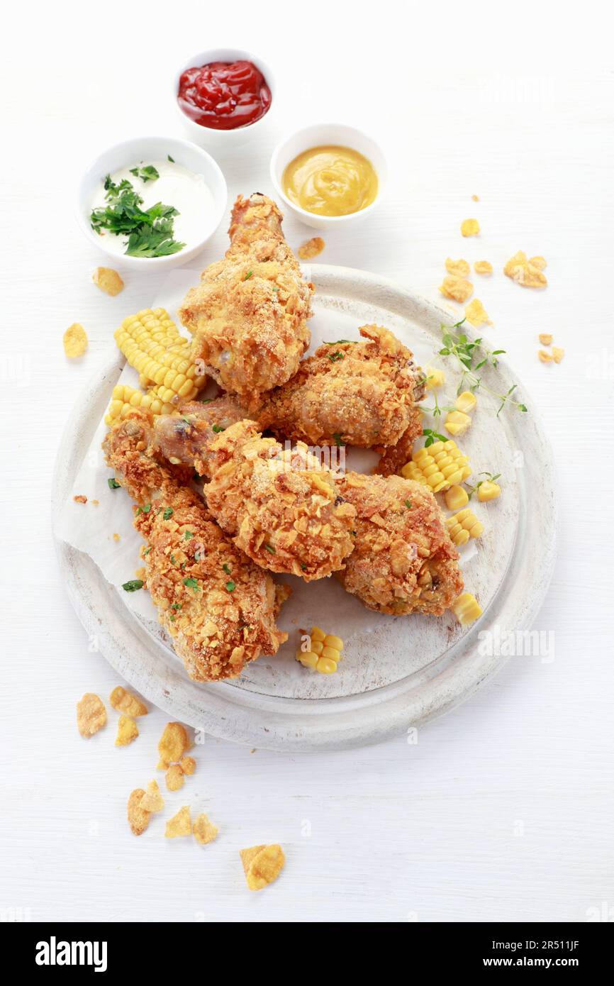 Chicken legs baked in corn flakes Stock Photo Alamy