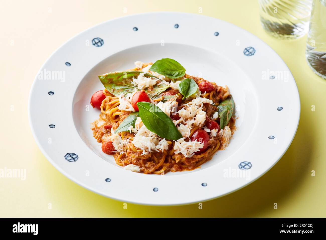 Spaghetti with tomato ragout, Parmesan and basil Stock Photo - Alamy