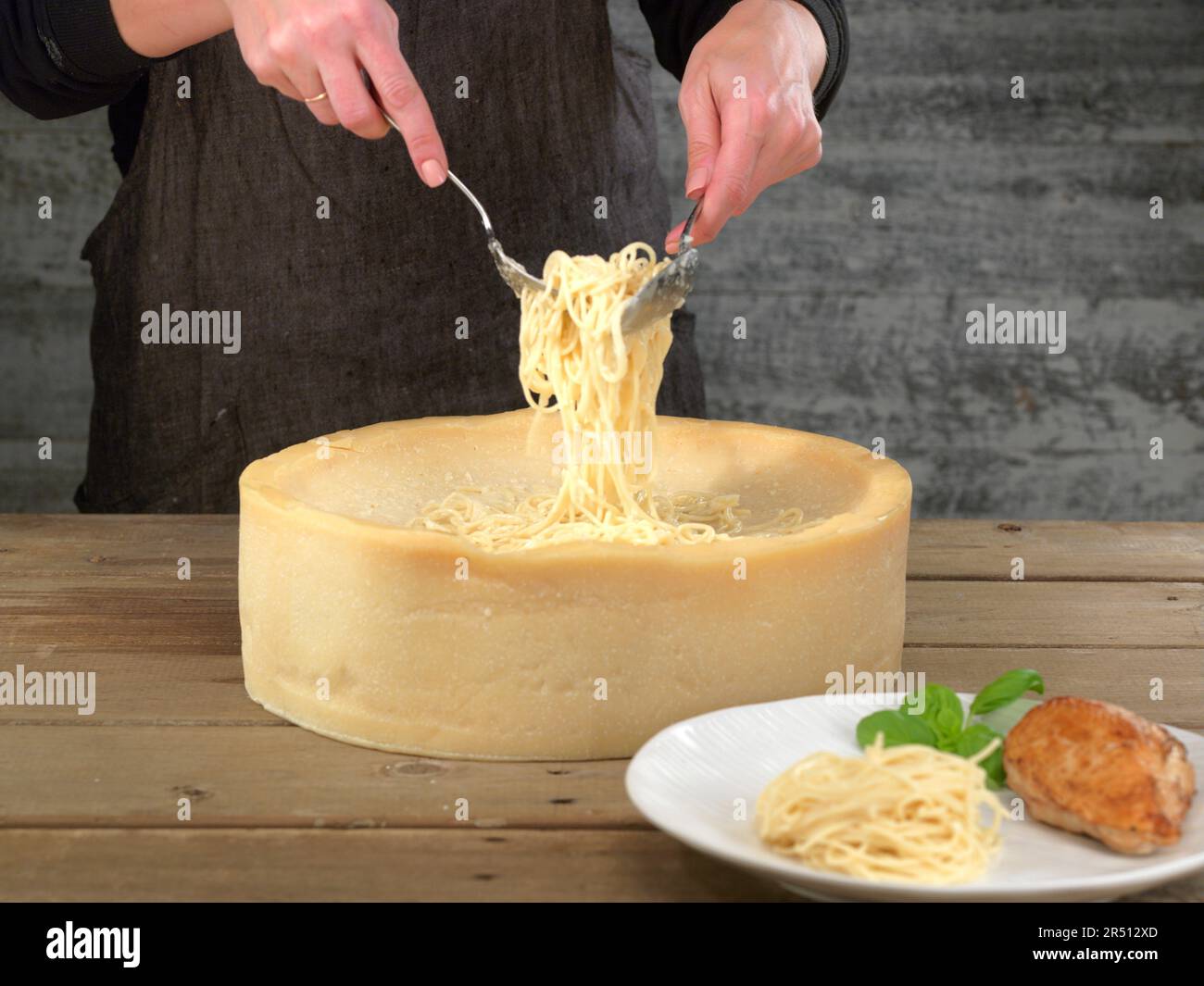 Parmesan wheel with spaghetti Stock Photo Alamy