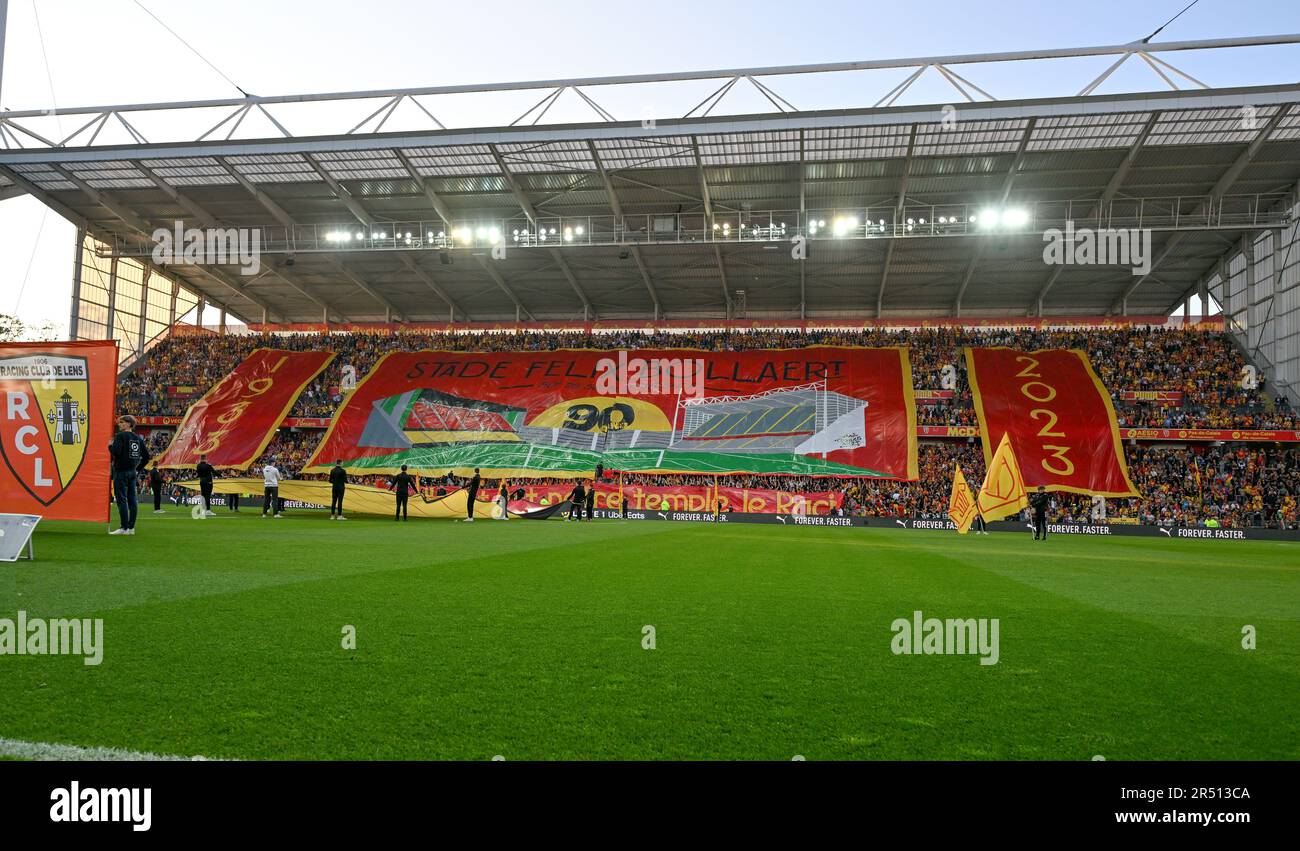 fans and supporters of Lens in stand tribune Marek and Xerces with a huge tifo of the 1933 - 2023 , 90 year anniversary of the Stadium Felix Bollaert on it pictured ahead of a soccer game between t Racing Club de Lens and AC Ajaccio, on the 37th matchday of the 2022-2023 Ligue 1 Uber Eats season , on  Sunday 27 May 2023  in Lens , France . PHOTO SPORTPIX | David Catry Stock Photo