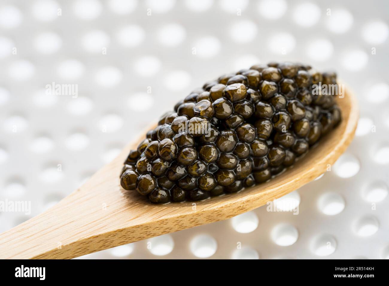 Caviar on a wooden spoon Stock Photo