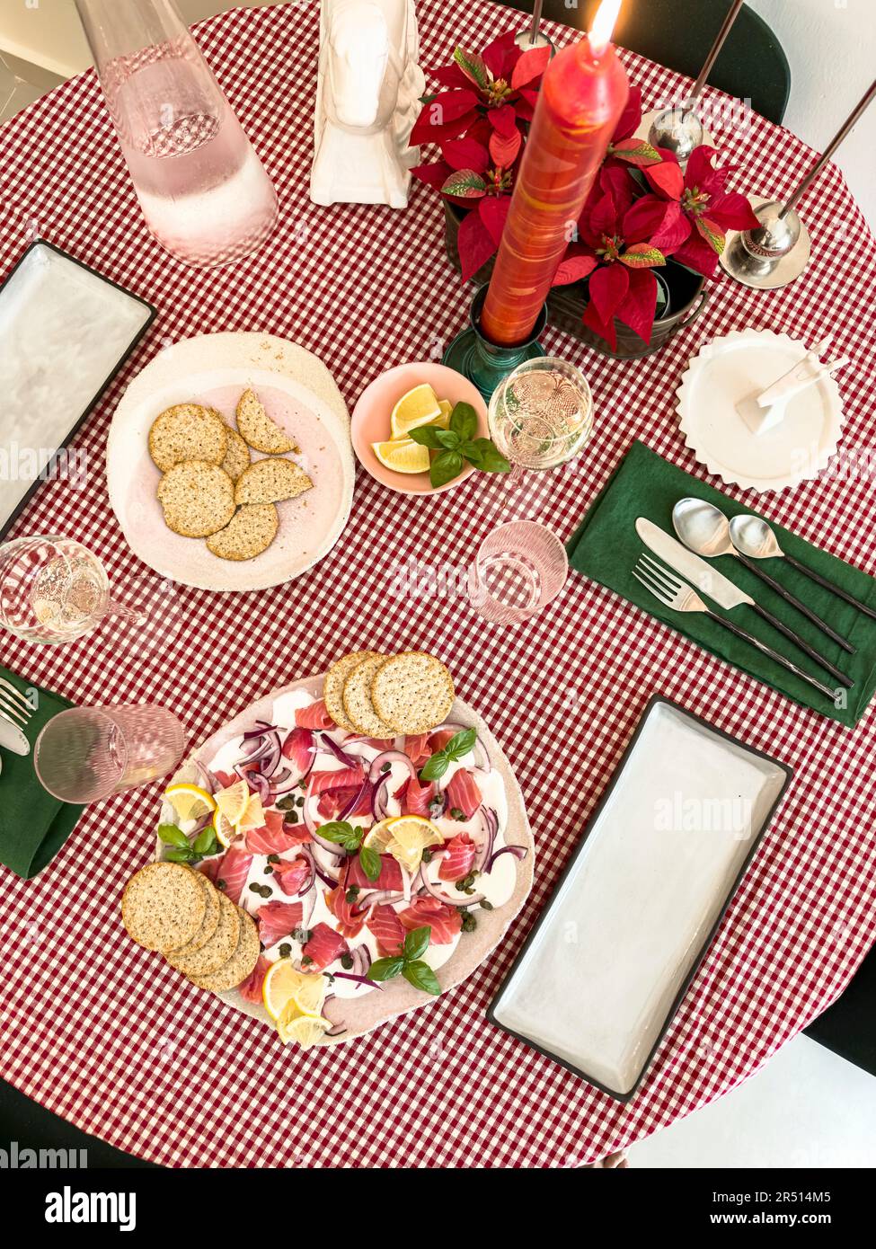 Festive table setting with beetroot and salmon platter and crackers Stock Photo