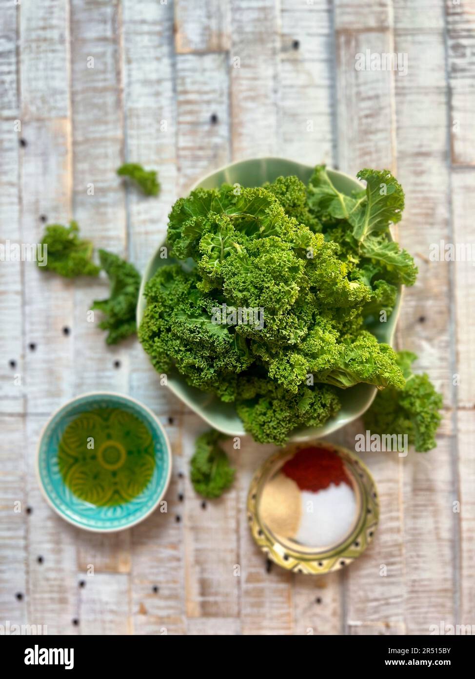 Ingredients for kale chips Fresh kale, oil and spices Stock Photo Alamy