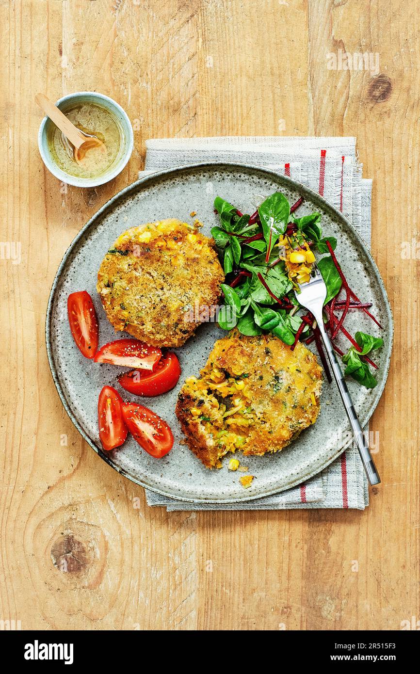 Courgette, sweetcorn and sweet potato cakes Stock Photo