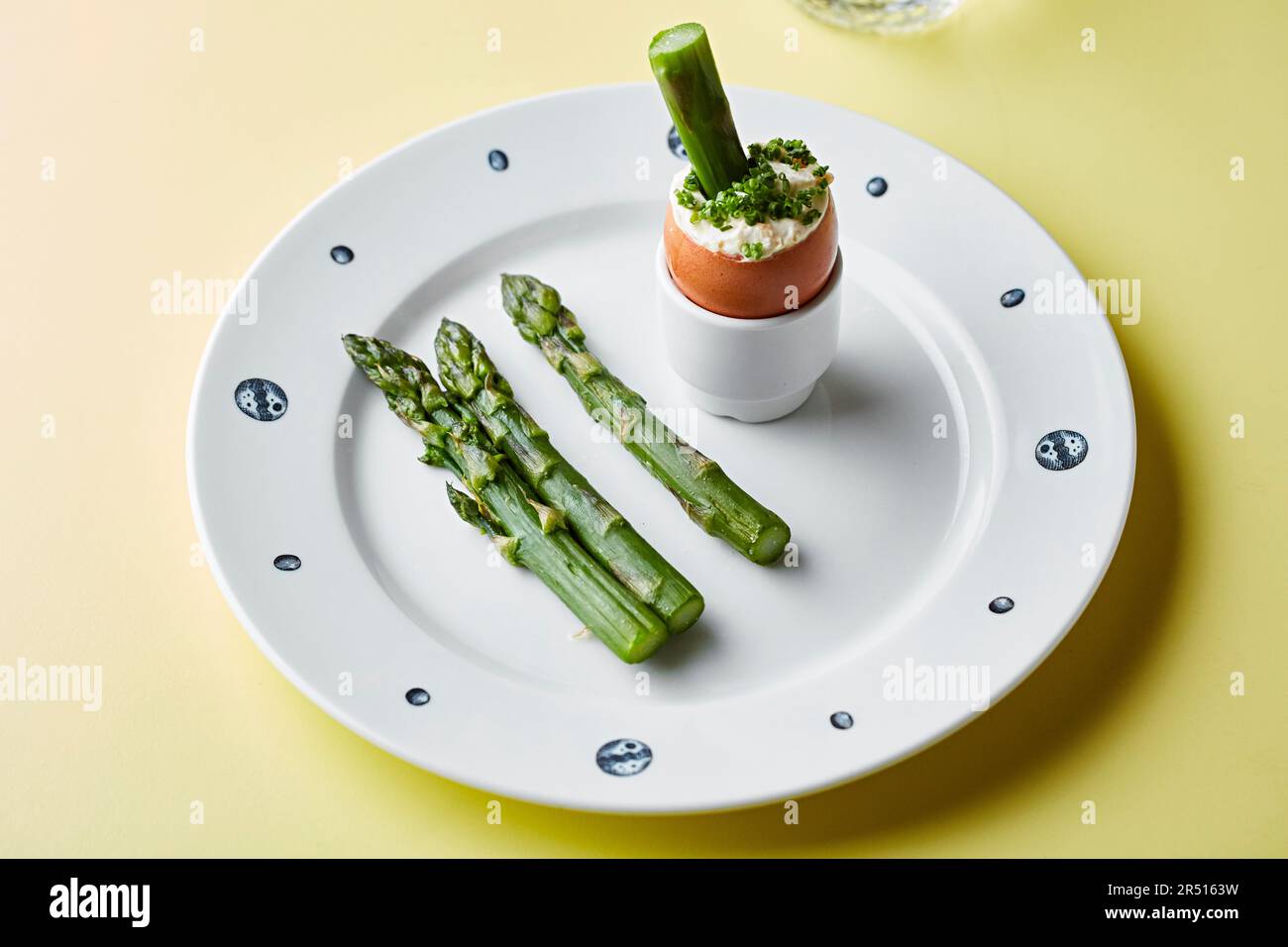 Asparagus tips with a soft boiled egg and chives Stock Photo Alamy