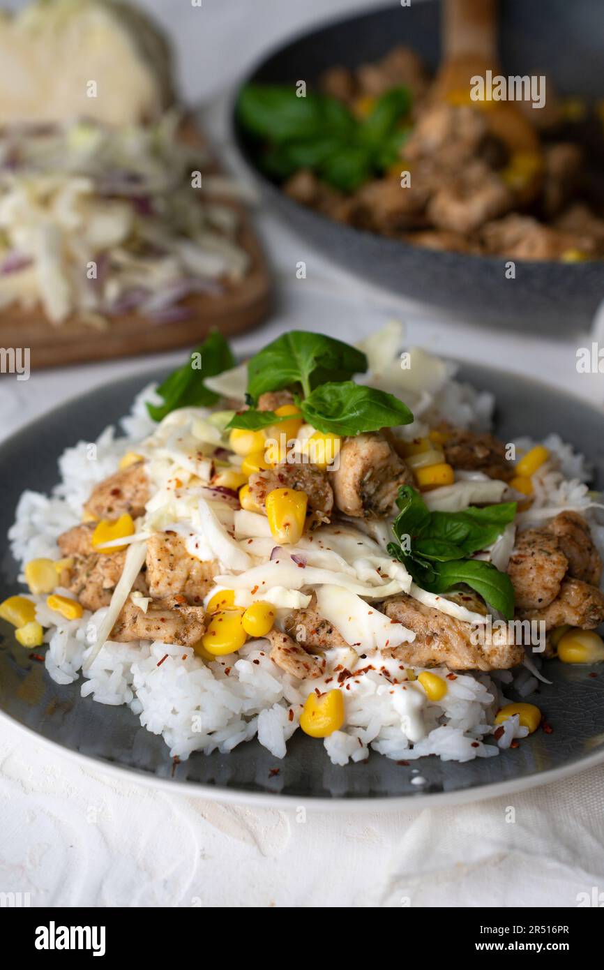 Quick lunch: Rice with chicken and sweetcorn Stock Photo - Alamy