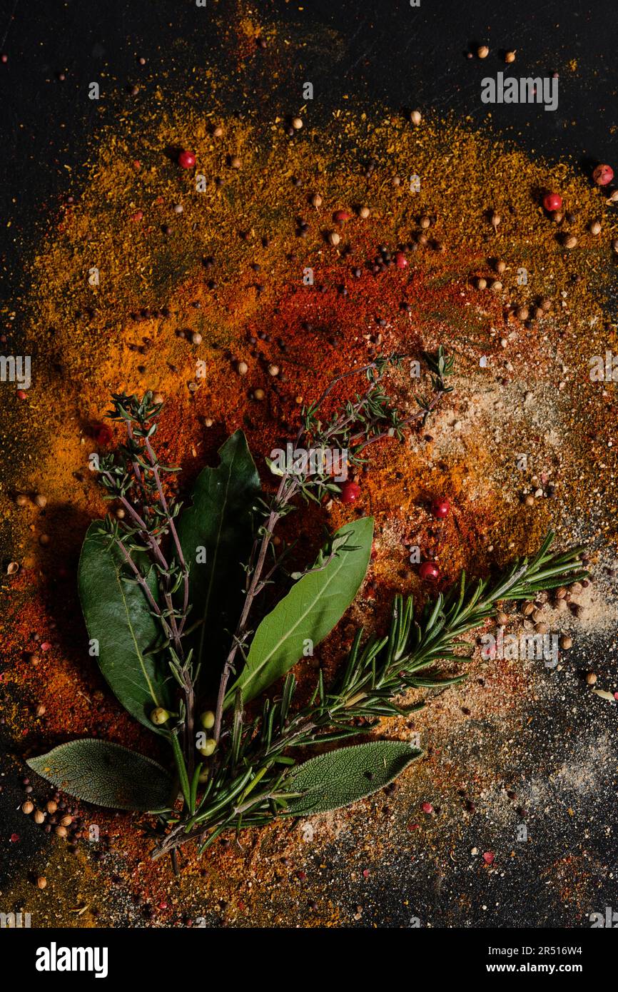 Rosemary, thyme and bay leaves on ground spices Stock Photo Alamy