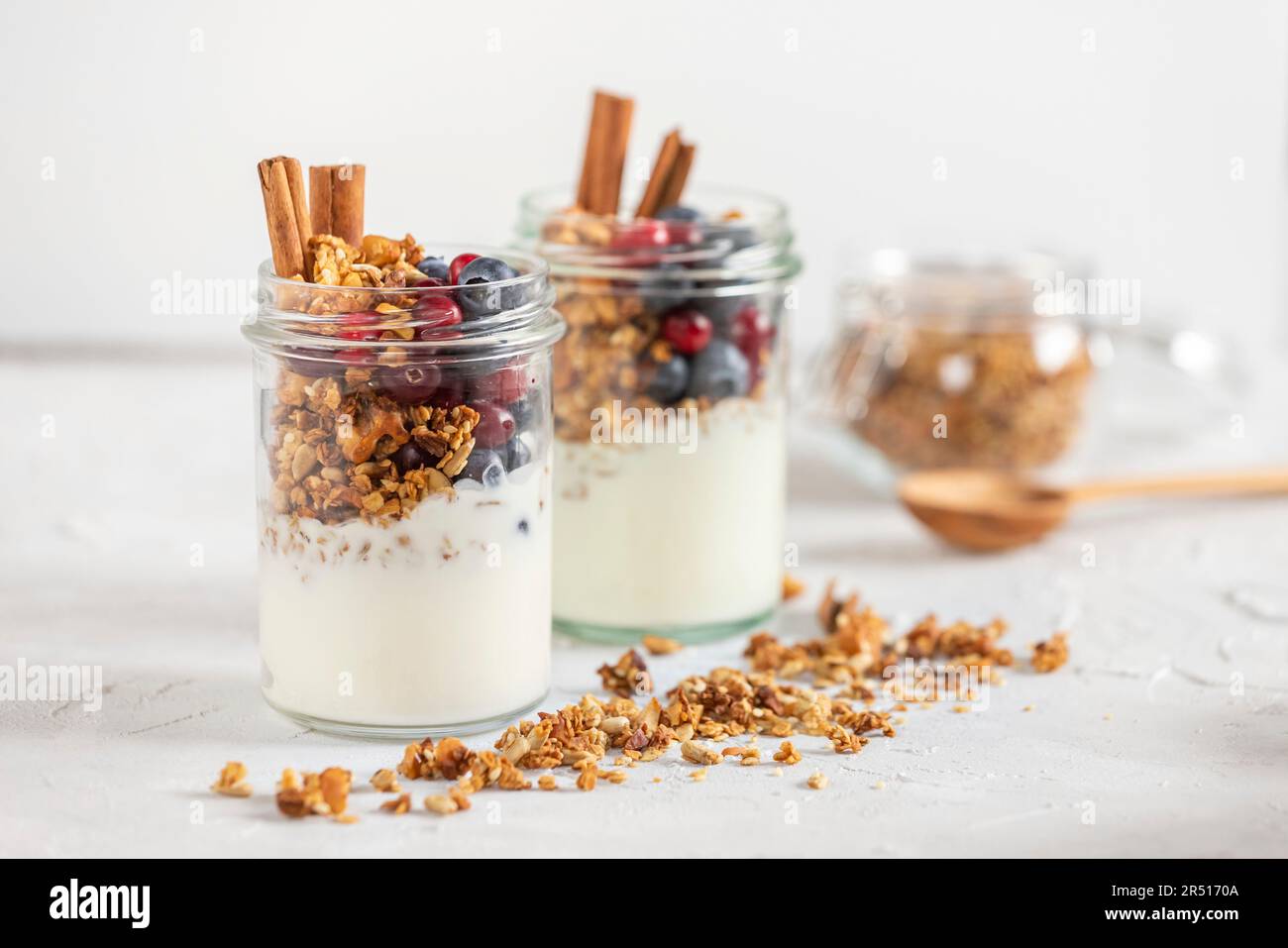 Granola in jars with yogurt, fruits and spices Stock Photo Alamy