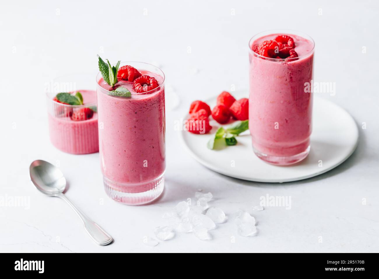 Raspberry smoothie with oat milk, soy yoghurt, lemon and mint Stock