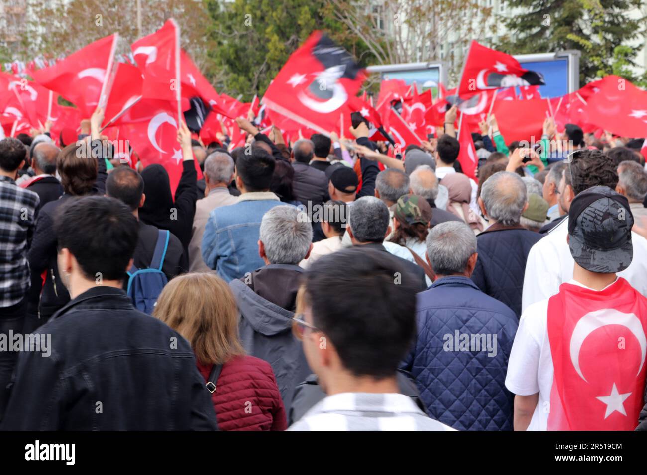 People waving Turkish flag at election rally in Turkey Stock Photo