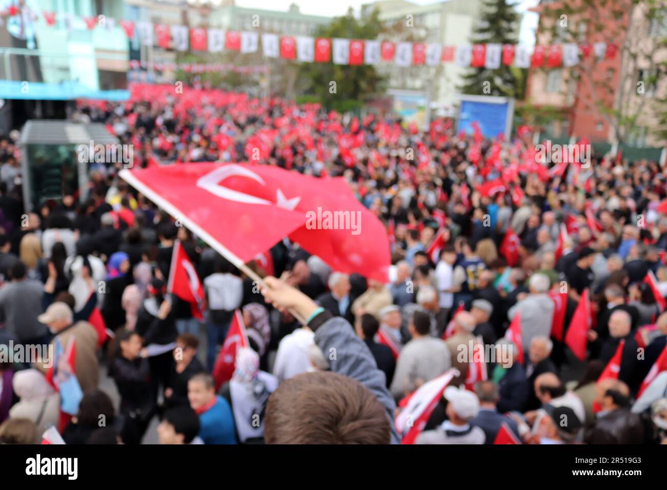 People waving Turkish flag at election rally in Turkey Stock Photo