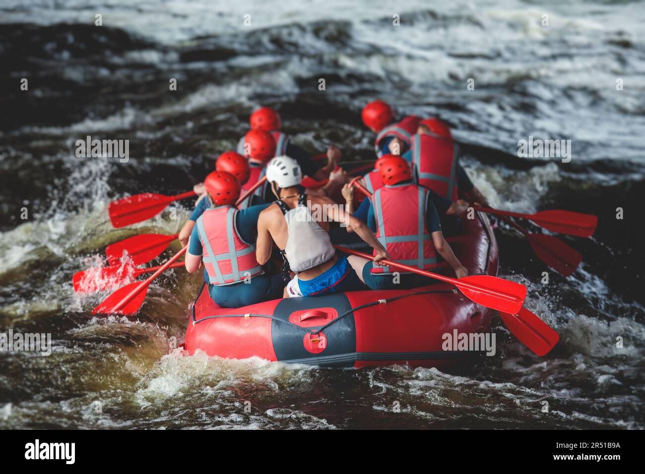 Red raft boat during whitewater rafting extreme water sports on water