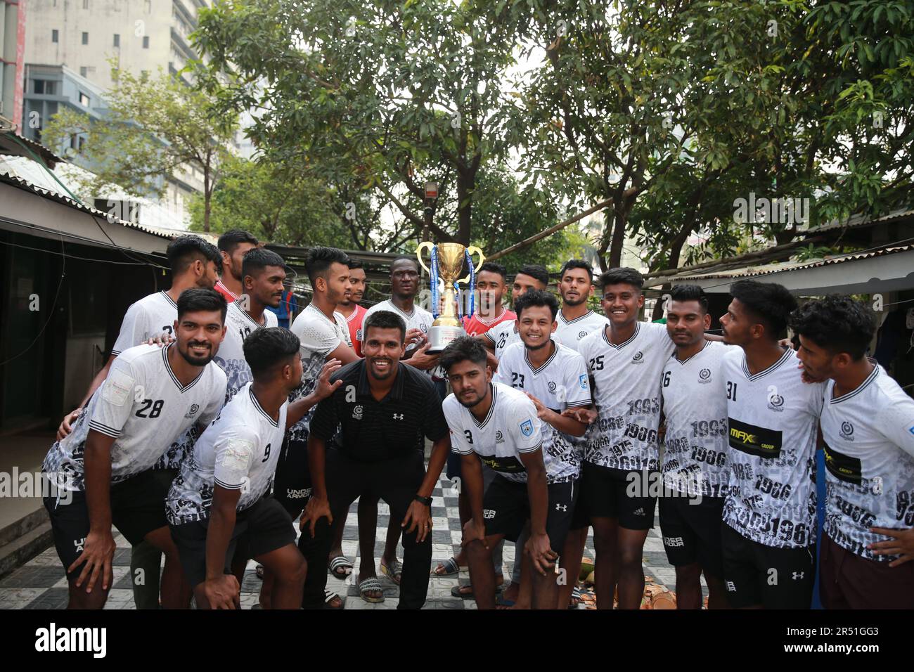 Players celebrate with the trophy of Federation Cup 2022-23 at Club premises in Motijheel, Dhaka Bangladesh. Stock Photo