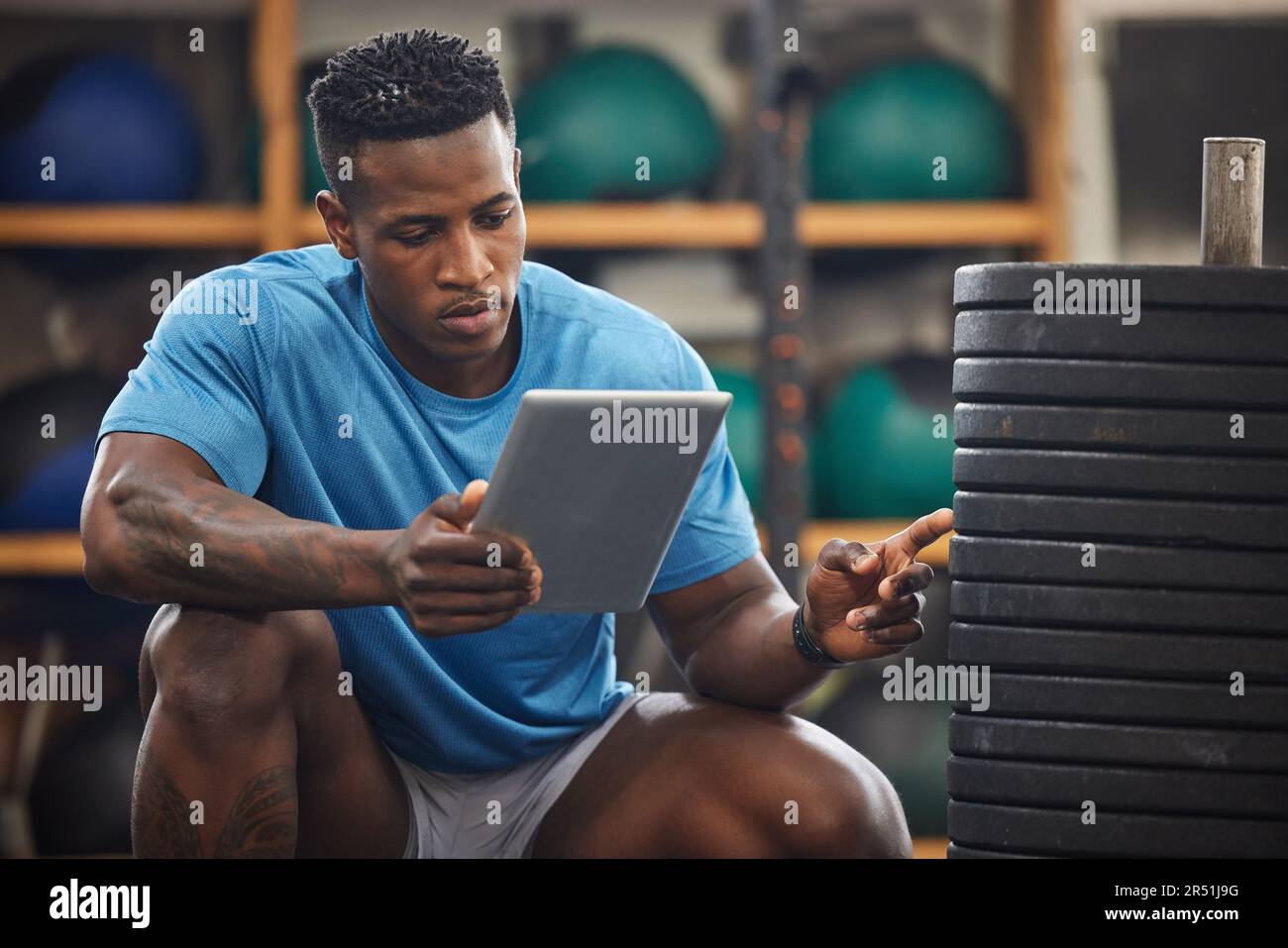 Gym inspection, exercise equipment and man with tablet,.weights for
