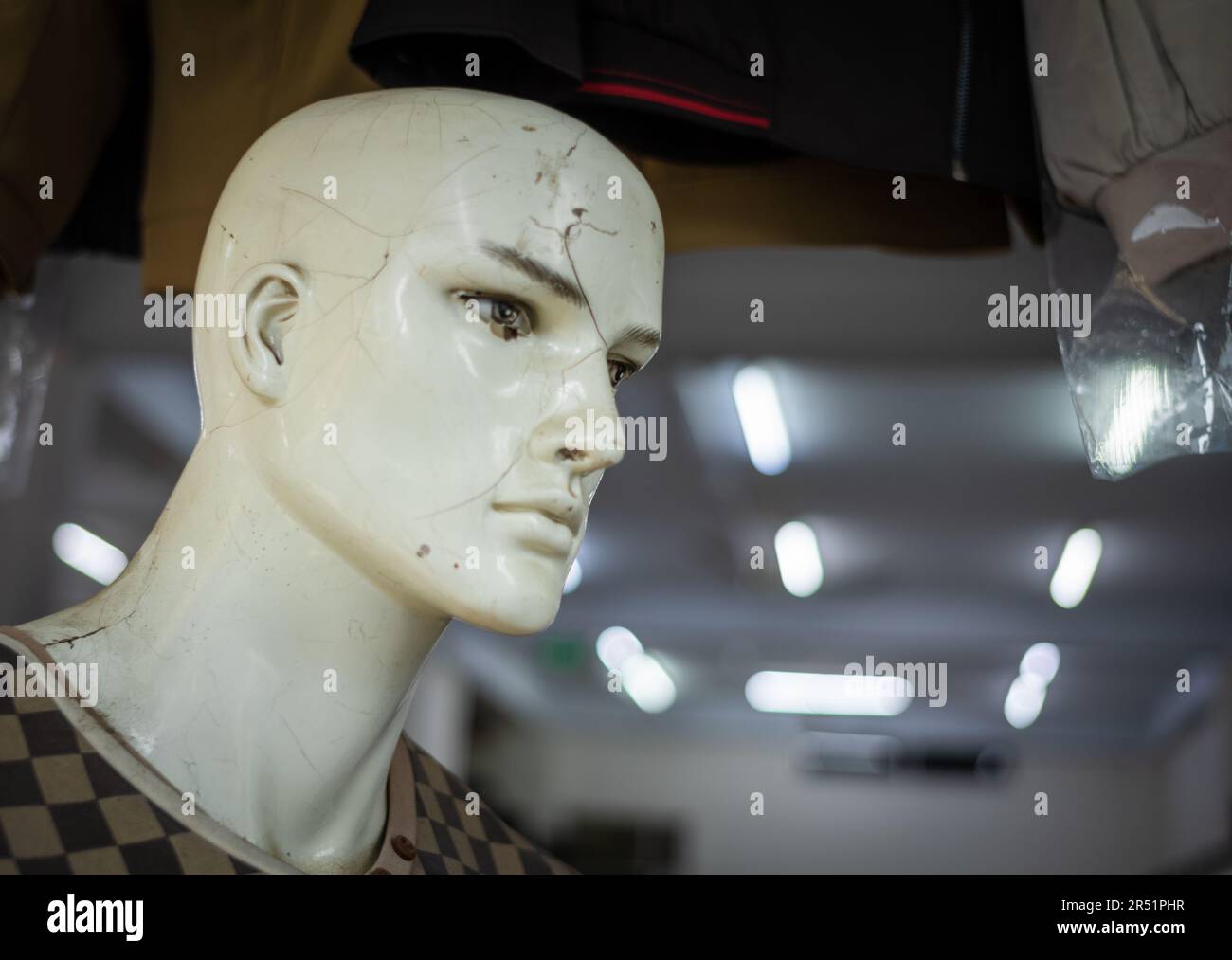 A battered shop dummy, or mannequin, in a shop in Danang, Vietnam Stock Photo