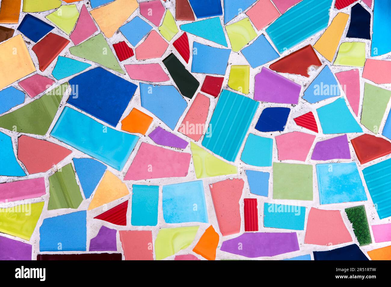 Colorful mosaic from broken tile and stone decorating on the wall for ...